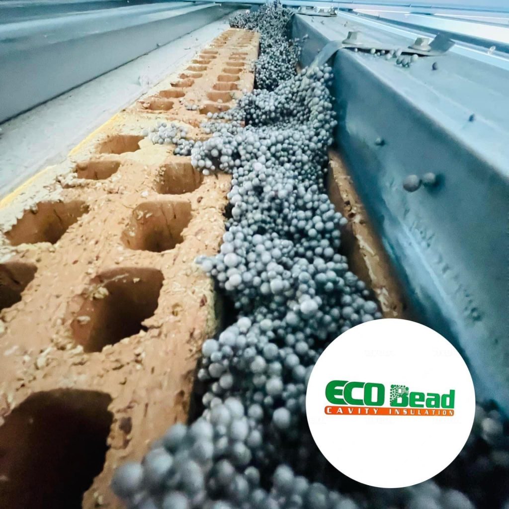 ### Key Elements
**Main Subjects**
- Insulation material (ECO Bead)
- Cavity wall structure
**Notable Features**
- Brown insulation blocks with holes
- Gray beads (insulation material) spilling from the cavity
**Text/Symbols**
- Logo for ECO Bead
### Overall Mood/Theme
The image conveys a focus on construction and insulation, highlighting the practical application of ECO Bead as a modern solution for cavity insulation. The mood is technical and informative, emphasizing efficiency and innovation in building materials.